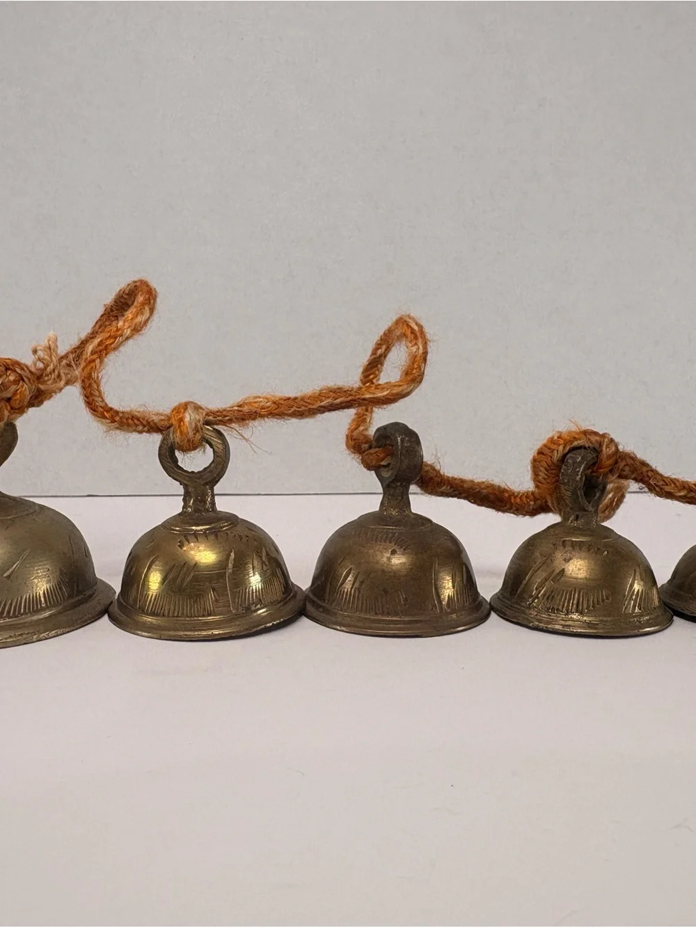 🔔 Vintage Graduated Brass Bells on Rope Garland – Rustic Temple Cow Bells – 24